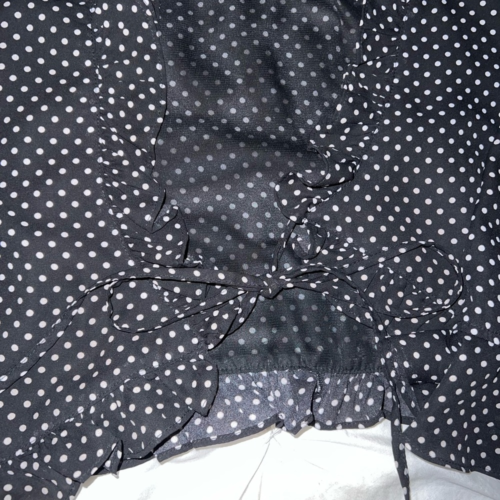 Black and white polka dot going out top- ties in front